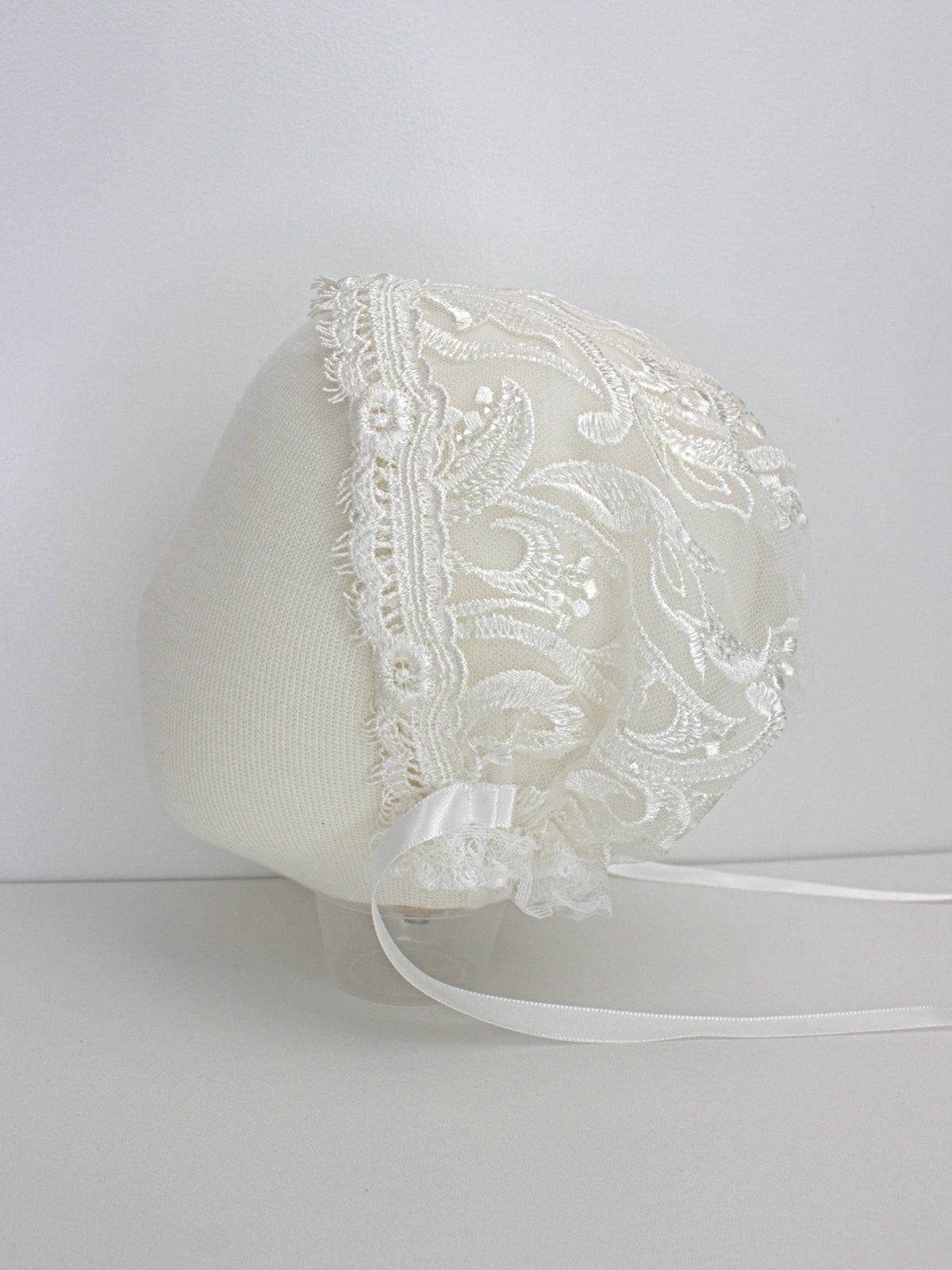 My Blessing ivory christening bonnet from the Divine set with lace embroidery and satin ties.