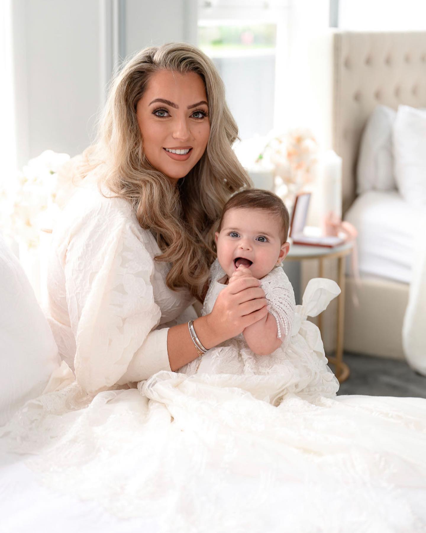 My Blessing Elora ivory christening gown featuring an embroidered lace bodice adorned with reflective sequins, glass seed beads, and Swarovski crystal beadwork.