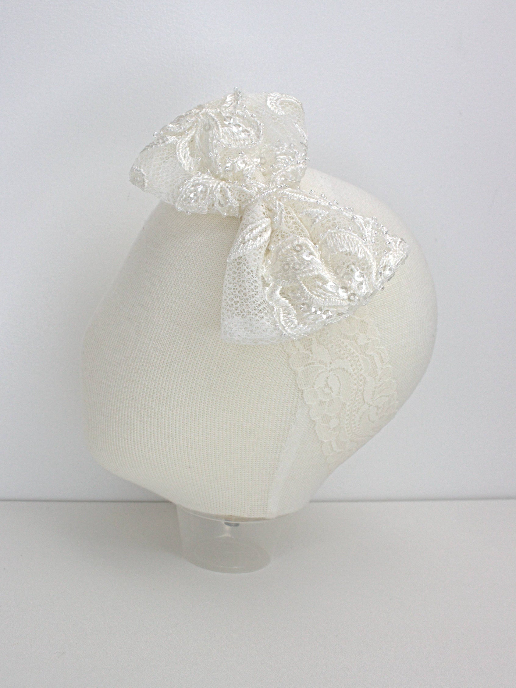 My Blessing ivory baby headband with a lace flower embellishment from the Glorious christening set.