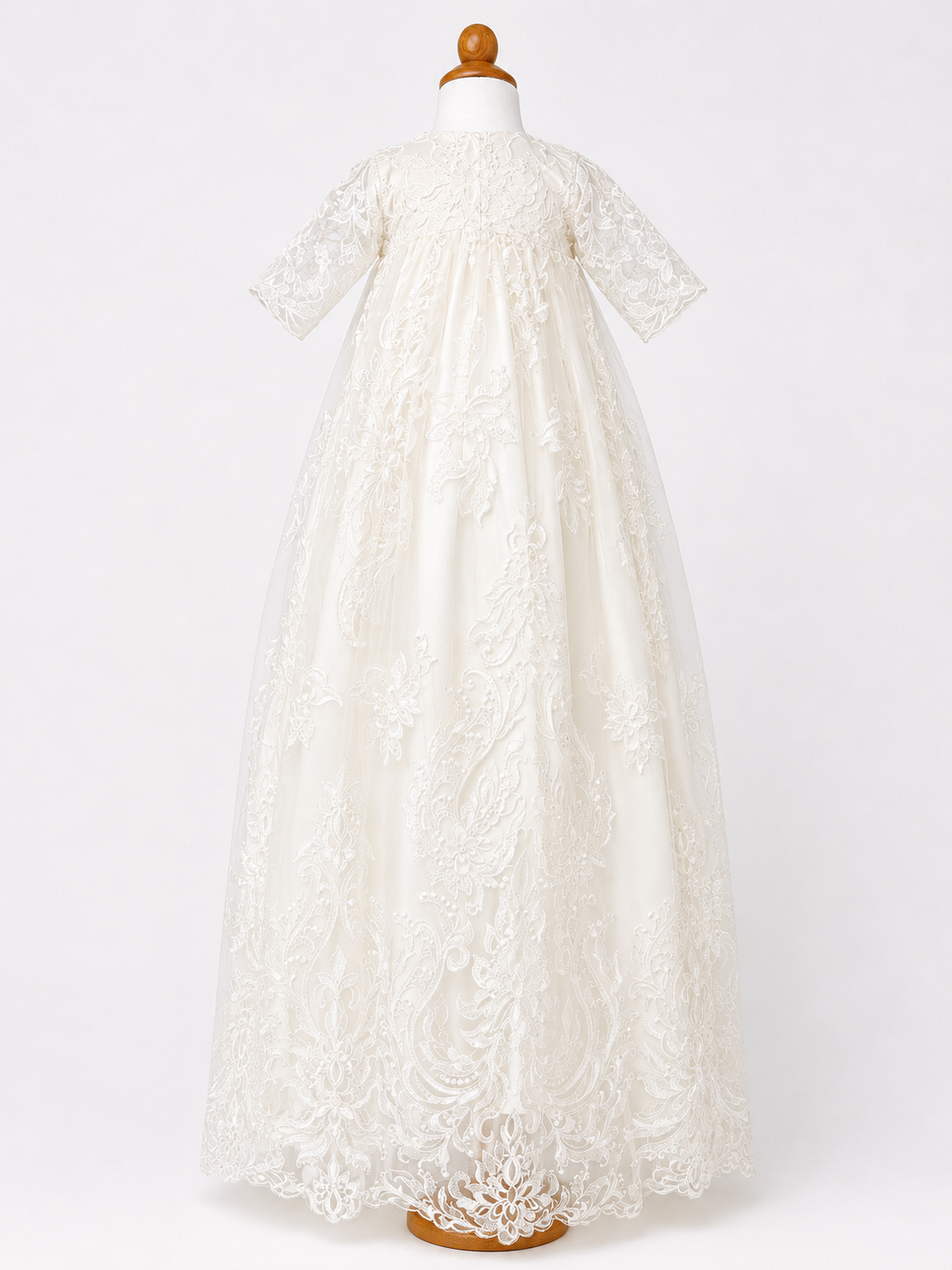 Front full length image of the My Blessing Grateful christening gown’s front bodice showing detailed floral lace and bead embroidery.