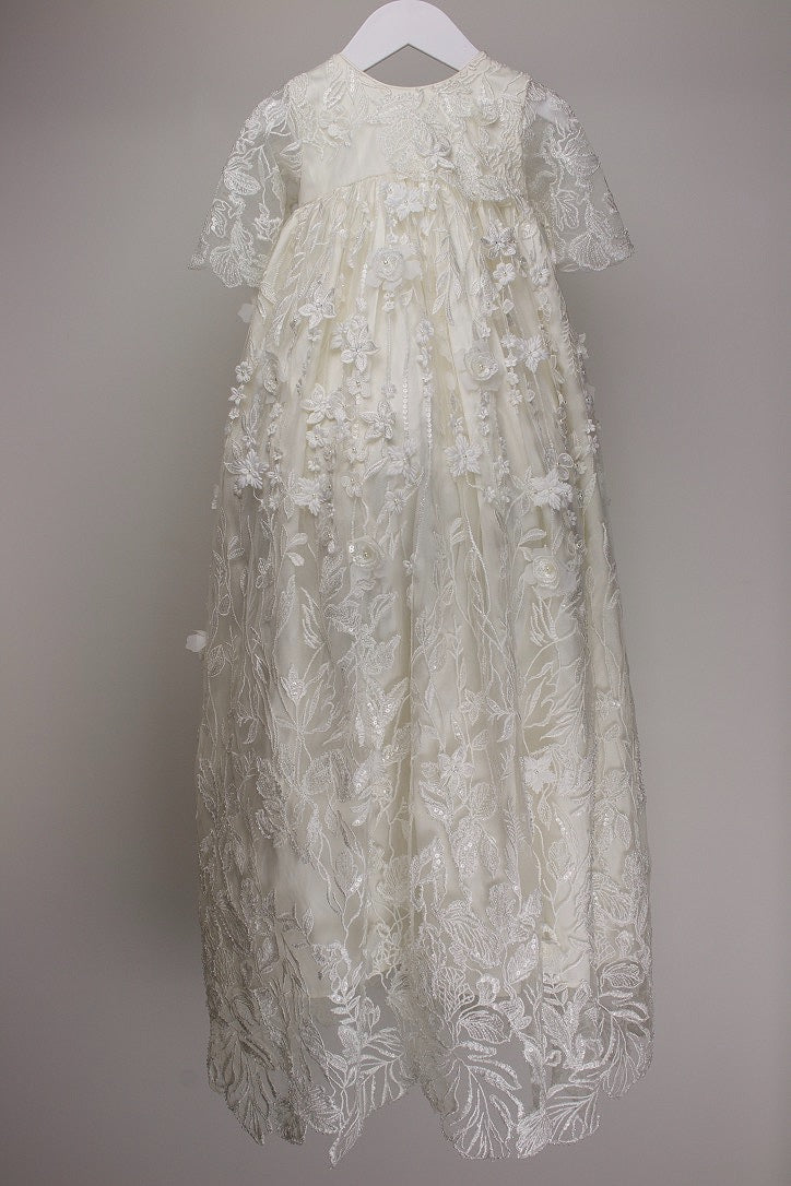 My Blessing Humble ivory full‑length christening gown featuring a floating European floral lace overlay with hand‑finished baby pearls, glass seed beads, and soft reflective sequins.