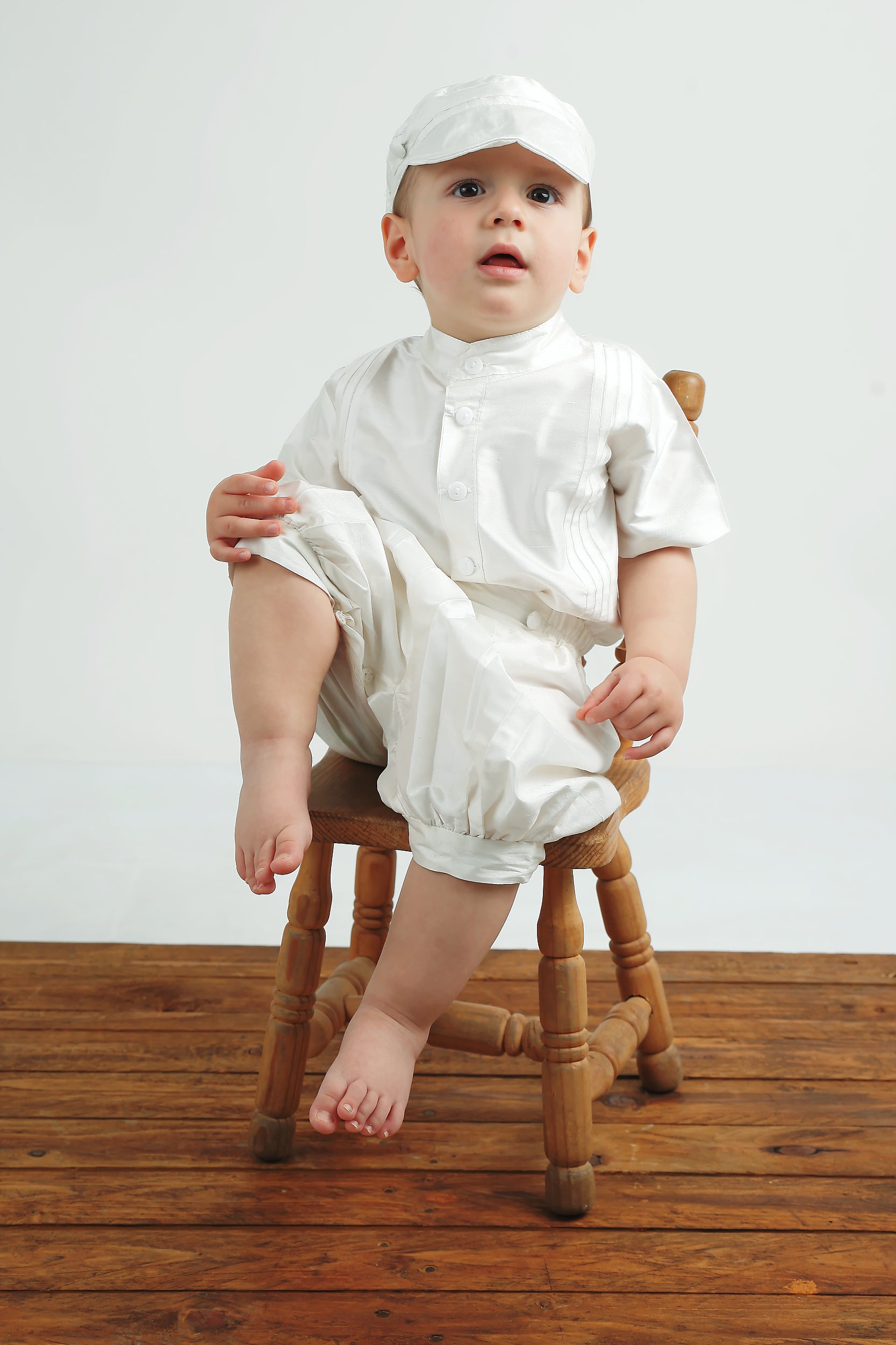 Baby boy posing in the My Blessing Lemuel Dupioni silk shirt and pants featuring refined, vintage‑inspired styling.