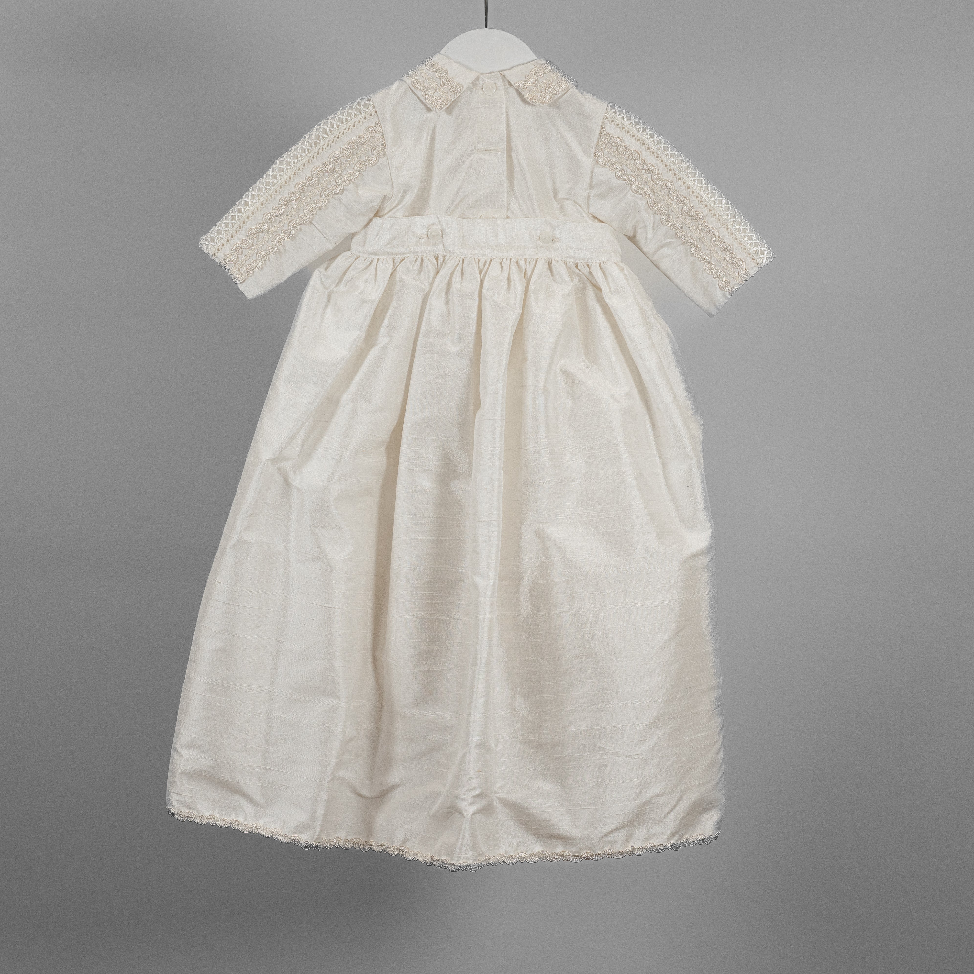 Back view of the My Blessing Noah baptism romper featuring smooth Dupioni silk and clean, traditional tailoring.