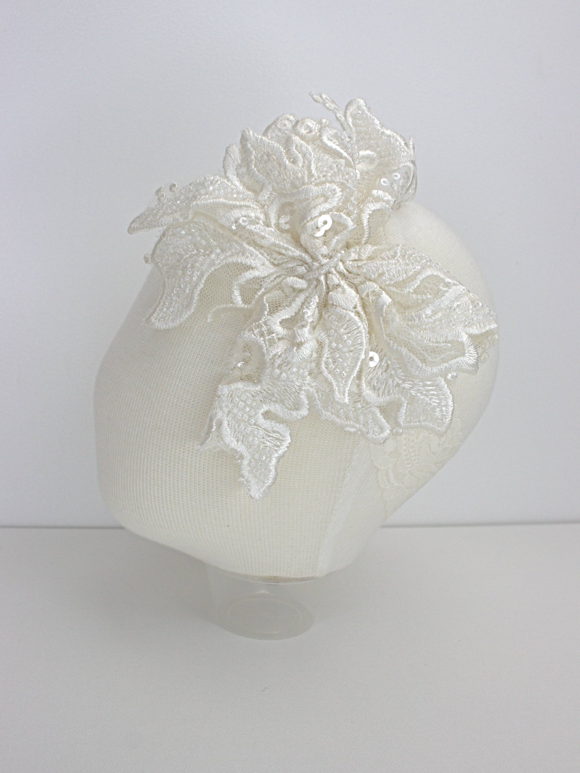 My Blessing Praise ivory baby headband with a lace flower embellishment from the Praise christening set.