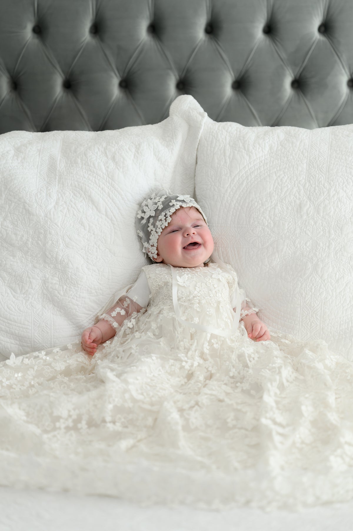 Ivory full‑length My Blessing Promise christening gown featuring a European floral bridal lace overlay with delicate glass seed bead detailing over pure silk.