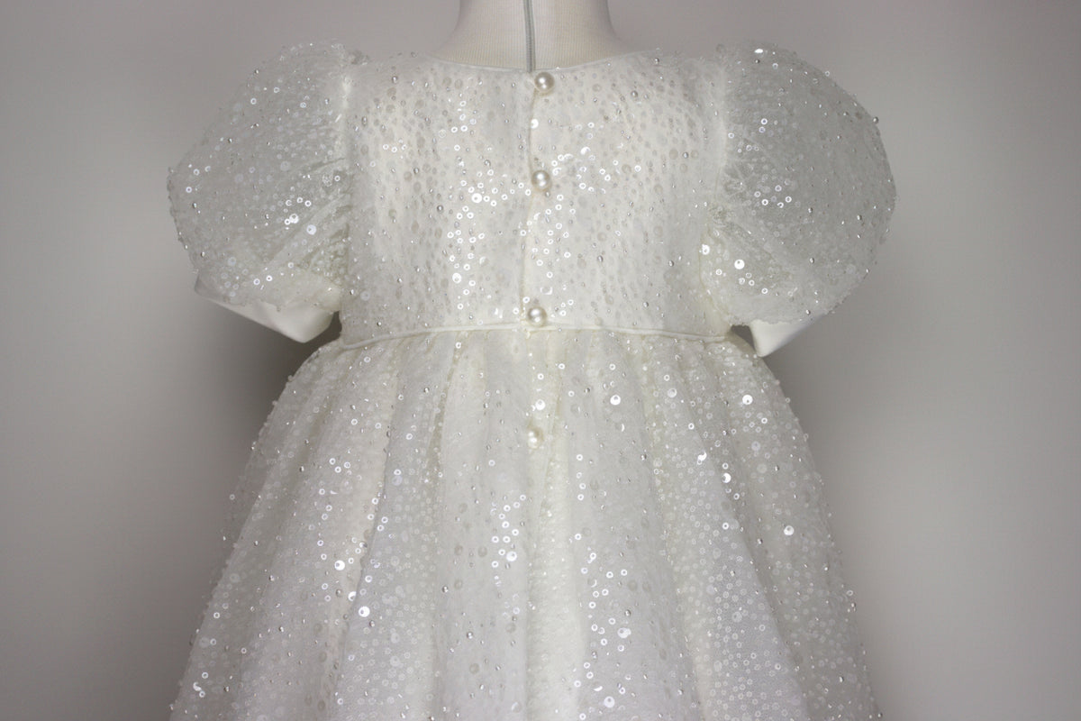 Close-up of the My Blessing Ruth dress’s back bodice featuring delicate lace patterns decorated with reflective sequins, glass seed beads, and miniature pearls.