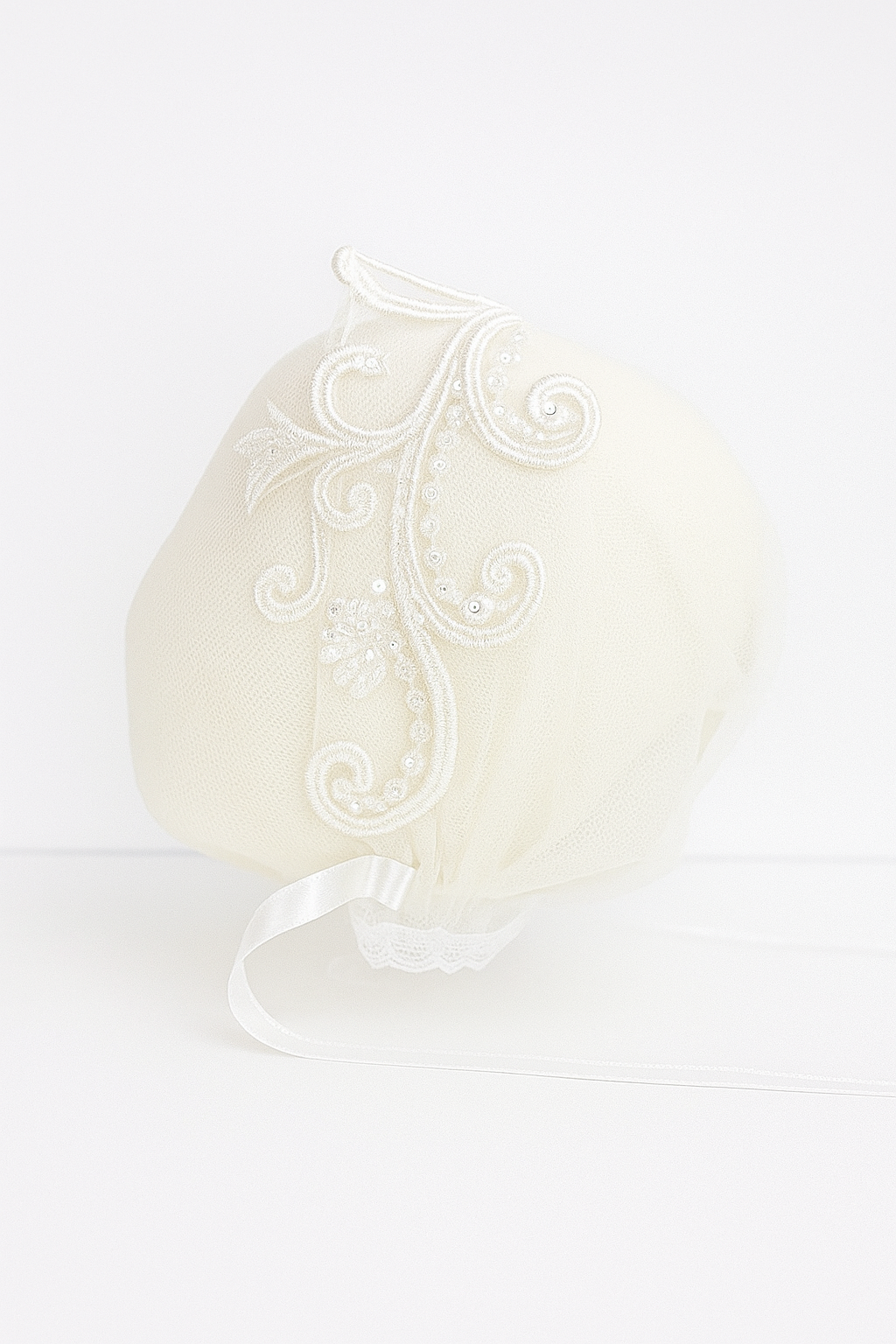 My Blessing Calm ivory christening bonnet from the Calm set with lace embroidery and satin ties.