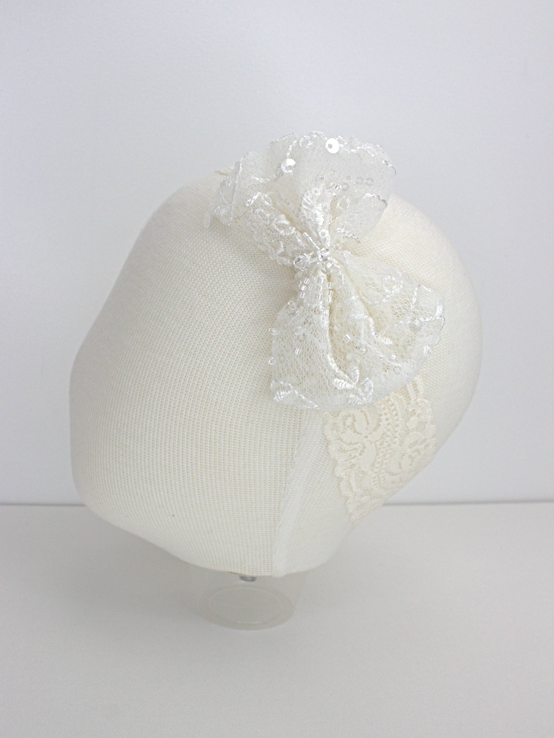 My Blessing Eternal ivory baby headband with a lace flower embellishment from the Eternal christening set.
