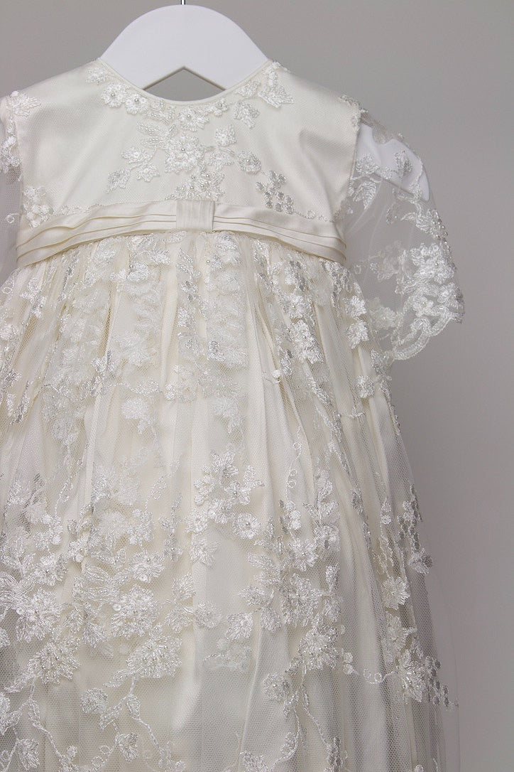 Close-up of the My Blessing Faith gown showing the intricate European floral lace embellished with subtle glass seed beads for a soft, elegant shimmer.