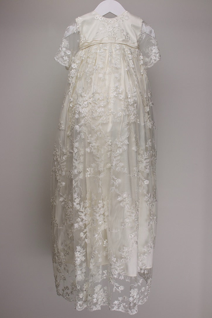Ivory full‑length My Blessing Faith christening gown featuring a European floral bridal lace overlay with delicate glass seed bead detailing over pure silk.