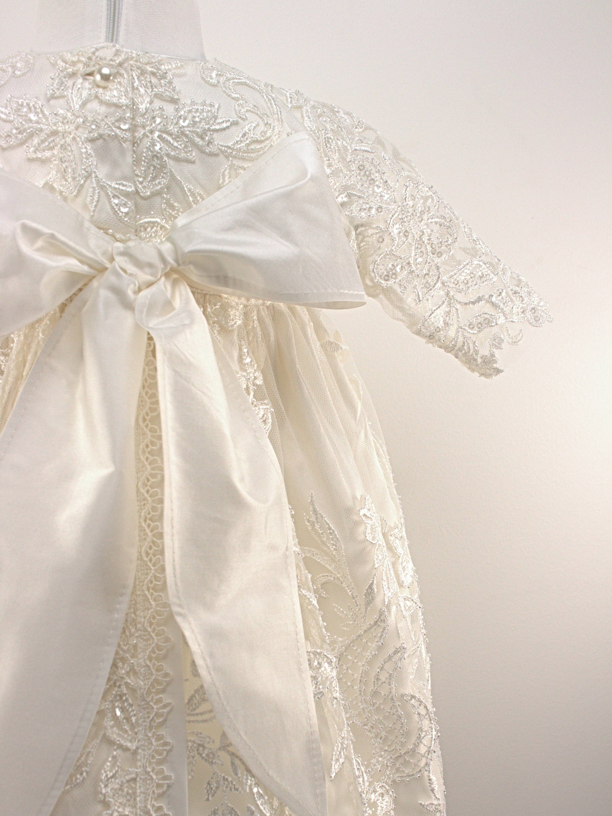 Close-up of the My Blessing Glorious gown’s back bodice featuring delicate lace patterns and button or tie closures.