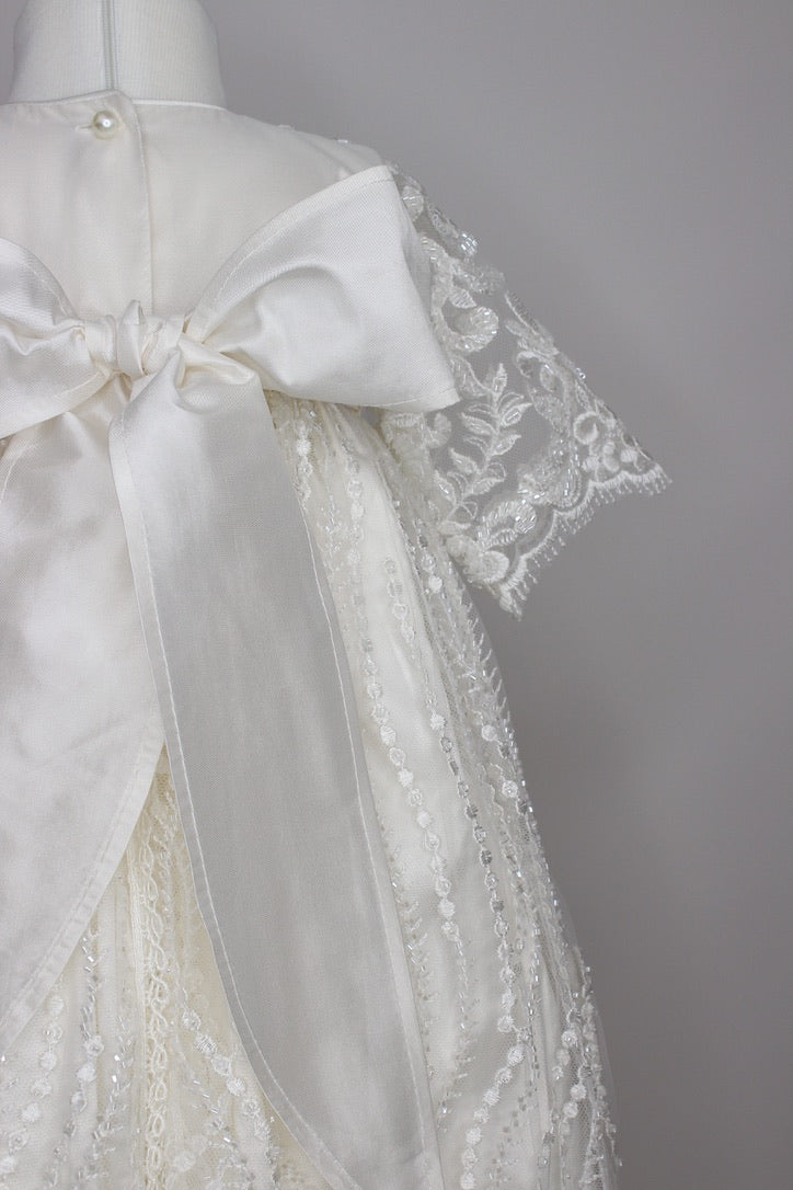 Close-up of the My Blessing Nineveh gown’s back bodice featuring pure silk bow, delicate lace patterns over a silk underlay.