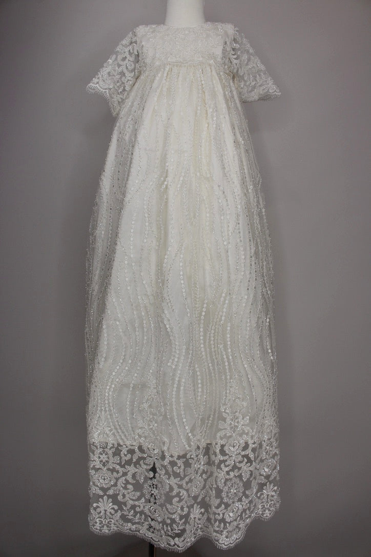 My Blessing ivory christening gown from the Nineveh exclusive release featuring an embroidered lace bodice, elegant sleeves, and a flowing silk‑underlay skirt.