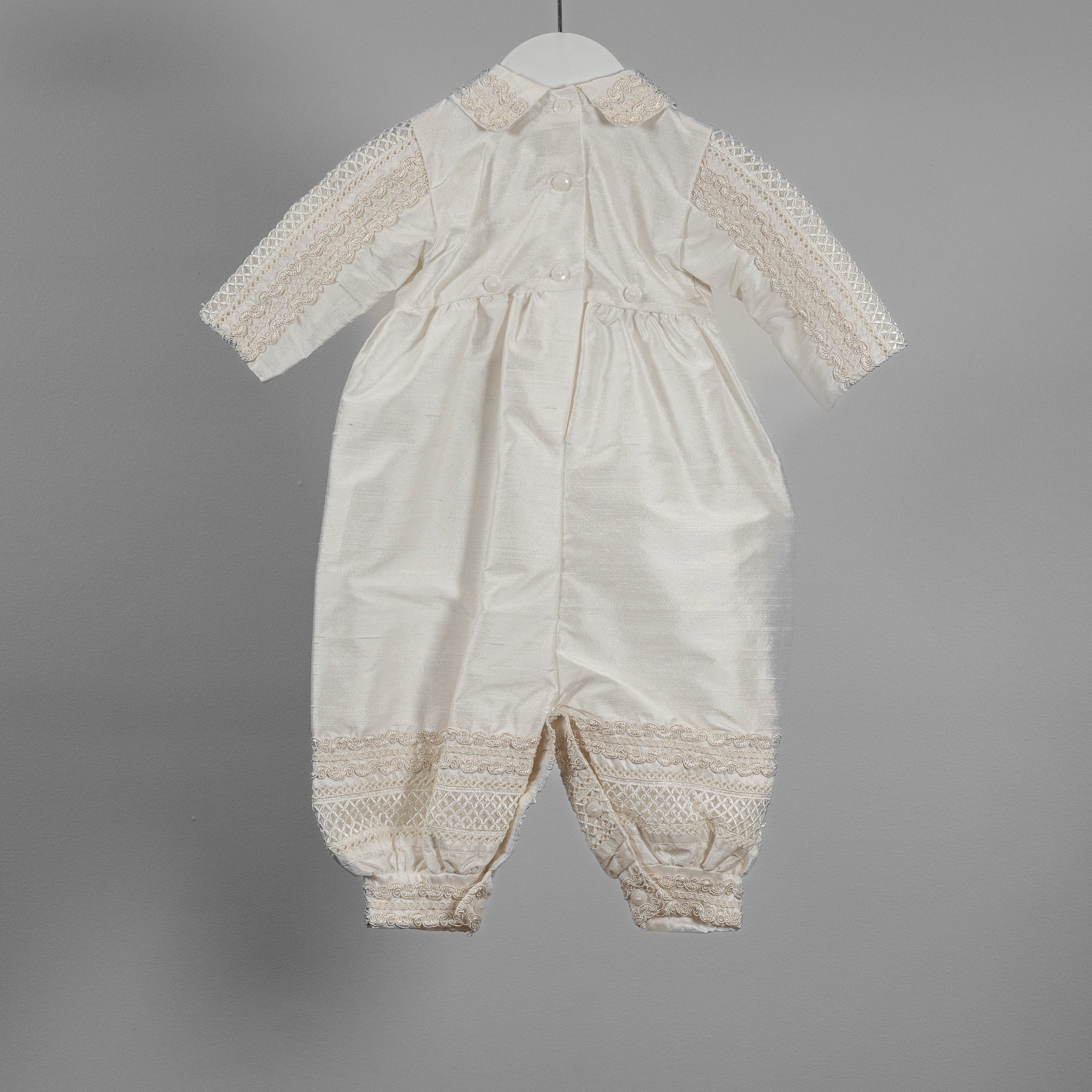 Close-up of the My Blessing Noah romper’s back bodice showing the natural sheen and structure of pure Dupioni silk.
