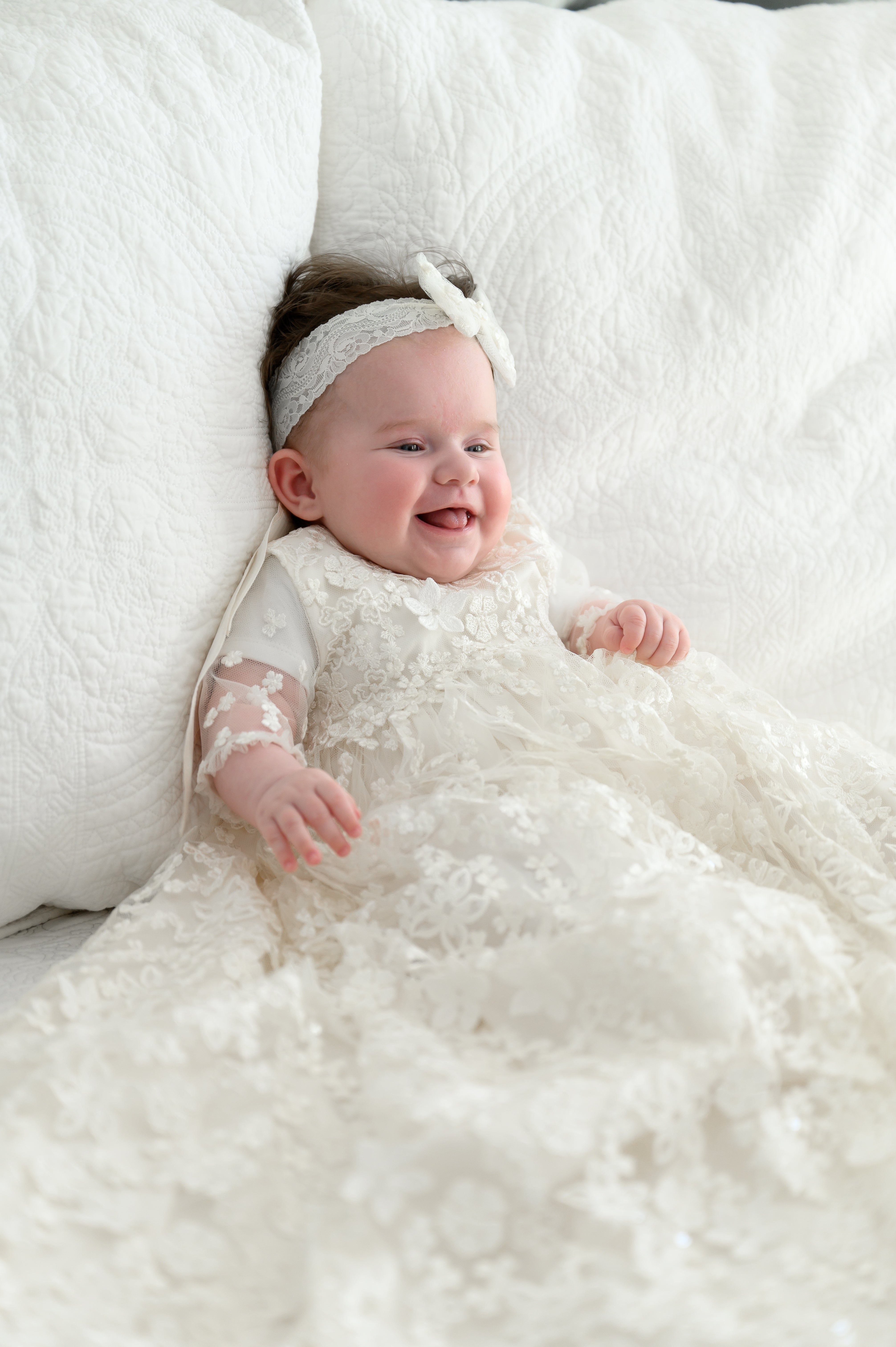 Ivory full‑length My Blessing Promise christening gown featuring a European floral bridal lace overlay with delicate glass seed bead detailing over pure silk.