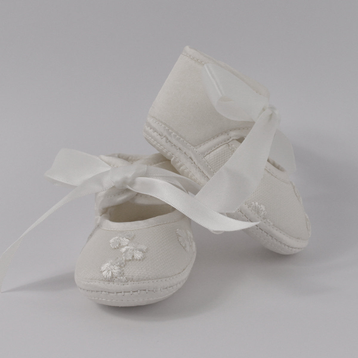 Ivory christening shoes from the My Blessing Promise set featuring European lace with subtle glass seed bead detailing.
